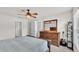 Relaxing bedroom featuring a large dresser, accents of green plants, and neutral carpet at 2030 Country Manor St, Bartow, FL 33830