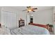 Bright bedroom featuring neutral carpet, ceiling fan, and adjacent closet at 2030 Country Manor St, Bartow, FL 33830