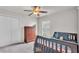 Bedroom with ceiling fan, closet, and window with natural light at 2030 Country Manor St, Bartow, FL 33830