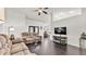 Bright living room featuring high ceilings, dark floors and an open layout at 2030 Country Manor St, Bartow, FL 33830