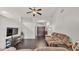 Bright living room featuring hardwood floors, a ceiling fan, and a comfortable couch at 2030 Country Manor St, Bartow, FL 33830