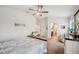 Cozy bedroom featuring a ceiling fan, and ensuite bathroom, designed for relaxation at 2085 Pecos Dr, Kissimmee, FL 34759