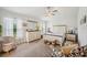 Well-lit main bedroom featuring neutral paint, carpet flooring, and large windows at 2085 Pecos Dr, Kissimmee, FL 34759