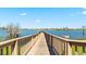 Picturesque wooden dock extending over a serene lake at 2210 Moraine Ct, Lakeland, FL 33805