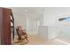 Bright hallway with rocking chairs and dark wood bookcase at 2210 Moraine Ct, Lakeland, FL 33805