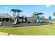 Fun playground area with slides and play structures, perfect for children at 2210 Moraine Ct, Lakeland, FL 33805