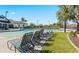 Relaxing lounge chairs offer scenic views of the pool and landscaped surroundings at 2210 Moraine Ct, Lakeland, FL 33805