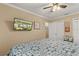 Bedroom featuring a ceiling fan and a flatscreen TV mounted on the wall at 27836 Lois Dr, Tavares, FL 32778