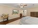 Bedroom featuring a ceiling fan and an entertainment center recessed into the wall at 27836 Lois Dr, Tavares, FL 32778