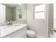 Charming bathroom showcasing a marble vanity, toilet, and subway tile at 2924 Bellwood Ave, Lakeland, FL 33803