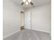 Neat bedroom featuring a fan, carpet, and white-painted walls at 2924 Bellwood Ave, Lakeland, FL 33803