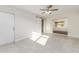 Bedroom with tile flooring, barn door to closet, and a ceiling fan at 2924 Bellwood Ave, Lakeland, FL 33803