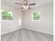 Cozy bedroom featuring neutral walls, carpet flooring, and a ceiling fan at 2924 Bellwood Ave, Lakeland, FL 33803