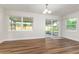 Spacious living room with wood floors and large windows for natural light at 2924 Bellwood Ave, Lakeland, FL 33803