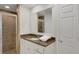 Bathroom featuring granite countertops, a tiled shower, and ample cabinet space at 2987 Mission Lakes Dr # 10, Lakeland, FL 33803