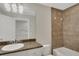 Bathroom featuring tiled walls, granite vanity, and a shower-tub combo at 2987 Mission Lakes Dr # 10, Lakeland, FL 33803