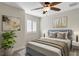 Bedroom featuring a ceiling fan, queen sized bed, and plantation shutters at 2987 Mission Lakes Dr # 10, Lakeland, FL 33803