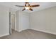 Bedroom featuring a ceiling fan, closet, and doorway at 2987 Mission Lakes Dr # 10, Lakeland, FL 33803