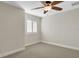 Bedroom featuring a ceiling fan and plantation shutters at 2987 Mission Lakes Dr # 10, Lakeland, FL 33803