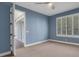 Bedroom featuring ceiling fan, carpeted floors, and sliding glass doors at 2987 Mission Lakes Dr # 10, Lakeland, FL 33803