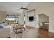 Staged Living room featuring vaulted ceiling, hardwood floors, and built in shelving at 2987 Mission Lakes Dr # 10, Lakeland, FL 33803