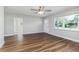 Spacious living room featuring attractive vinyl floors, a ceiling fan and natural light at 300 Senate St, Auburndale, FL 33823