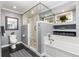 Bathroom featuring walk-in shower, soaking tub, dual sinks, and tile flooring at 3001 Plantation Rd, Winter Haven, FL 33884