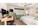 Bedroom featuring a desk, ceiling fan, and comfortable decor for a relaxing space at 3001 Plantation Rd, Winter Haven, FL 33884