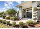 Elegant front entrance with manicured landscaping and a brick pathway leading to double doors at 3001 Plantation Rd, Winter Haven, FL 33884