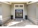 Inviting front entryway with double doors, decorative wreaths, and potted plants enhancing curb appeal at 3001 Plantation Rd, Winter Haven, FL 33884