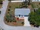 Aerial view of a well-kept single-story home with a manicured lawn, vibrant landscaping, and a spacious driveway at 3166 Valley Vista Cir, Lakeland, FL 33812