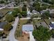 Aerial view of a charming home in a peaceful neighborhood with well-manicured lawns and mature trees at 3166 Valley Vista Cir, Lakeland, FL 33812