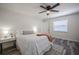 Cozy bedroom with neutral tones, a ceiling fan, and a window at 3166 Valley Vista Cir, Lakeland, FL 33812