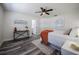 Inviting bedroom featuring wood-look floors, ceiling fan, and closet at 3166 Valley Vista Cir, Lakeland, FL 33812