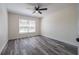 Bright bedroom with wood-look flooring and ceiling fan for a modern and fresh appeal at 3166 Valley Vista Cir, Lakeland, FL 33812