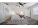 Well-lit bedroom with white walls, wood-look flooring, and a ceiling fan at 3166 Valley Vista Cir, Lakeland, FL 33812