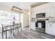 Bright kitchen and dining area with stainless steel appliances, modern flooring, and natural light from a large window at 3166 Valley Vista Cir, Lakeland, FL 33812