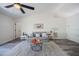 Comfortable living room featuring a gray sofa, wood-look flooring, and high ceilings at 3166 Valley Vista Cir, Lakeland, FL 33812