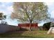 Backyard featuring a large tree with blooming pink flowers at 3626 Amber Ln, Lakeland, FL 33812