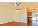 Open concept living room with vaulted ceilings, neutral paint colors, and wood look floors at 3626 Amber Ln, Lakeland, FL 33812