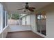 Enclosed patio with ceiling fan, screened windows, and a sliding glass door at 3626 Amber Ln, Lakeland, FL 33812