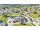 Aerial view showcasing the community's clubhouse, pool, tennis courts, green spaces, and tree-lined streets at 3717 Highland Fairways Blvd, Lakeland, FL 33810