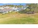 Aerial view of a lush, green backyard and patio, perfect for outdoor living and entertaining at 3717 Highland Fairways Blvd, Lakeland, FL 33810