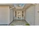 Cozy, covered front porch with tiled flooring and seating area, perfect for relaxing at 3717 Highland Fairways Blvd, Lakeland, FL 33810