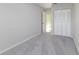 Neutral bedroom with gray carpet, neutral paint and closet storage at 4120 Old Colony Rd, Mulberry, FL 33860