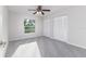 Bedroom with gray carpet, a large window and closet storage at 4120 Old Colony Rd, Mulberry, FL 33860