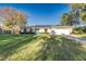 Charming single-story home with a well-manicured front lawn and a welcoming light blue front door at 4120 Old Colony Rd, Mulberry, FL 33860