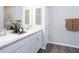 Bathroom featuring double vanity, marble countertop, and modern decor at 4374 River Birch Bnd, Lakeland, FL 33811