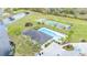 Aerial view of community amenities with pool, playground, tennis court, and clubhouse at 4759 Lathloa Loop, Lakeland, FL 33811