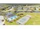 Aerial view featuring community pool, playground, tennis courts, and ponds at 4759 Lathloa Loop, Lakeland, FL 33811